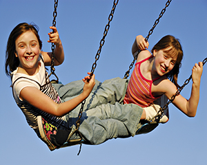 two girls on swingboat